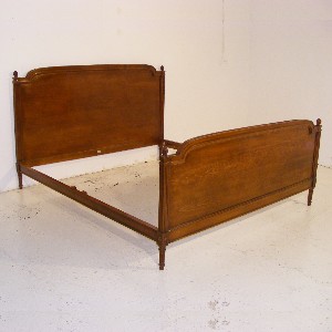 A Very Large Louis XVI Style Walnut Stained Beechwood Bed.