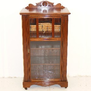 An Edwardian American Walnut Glazed Music/Display Cabinet.