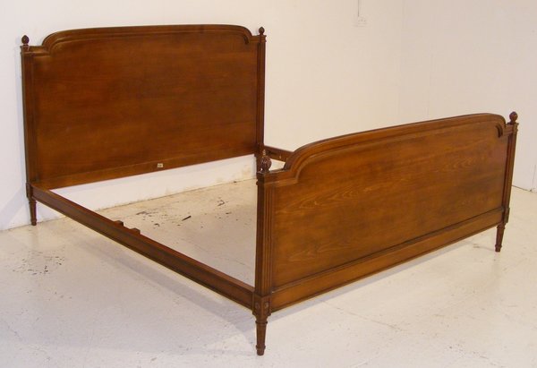 A Very Large Louis XVI Style Walnut Stained Beechwood Bed.