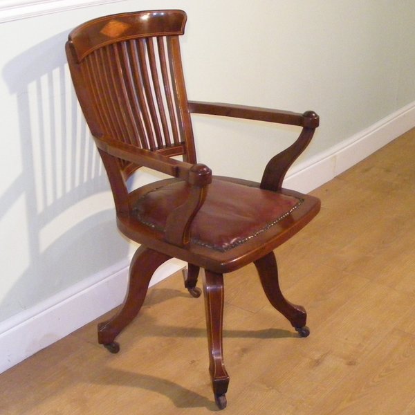 An Edwardian Mahogany And Inlaid Revolving Desk Chair